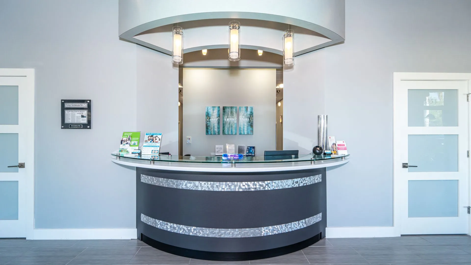 Curved front desk in the dental office reception area